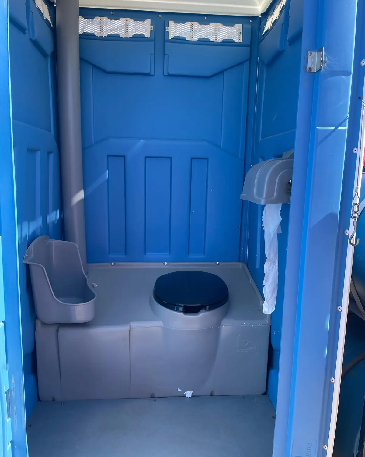 Interior of a winterized PolyJohn PJN3 porta potty with stocked tissue in Bethlehem PA